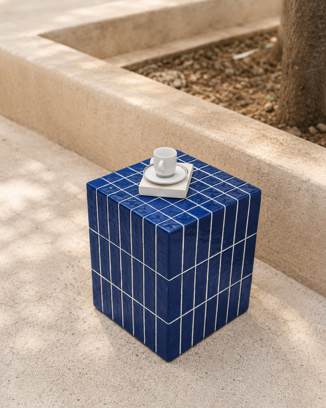 blue mosaic cube table used as a bath-side step stool