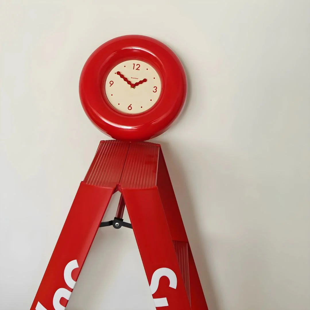 designer red wall clock for living room interior