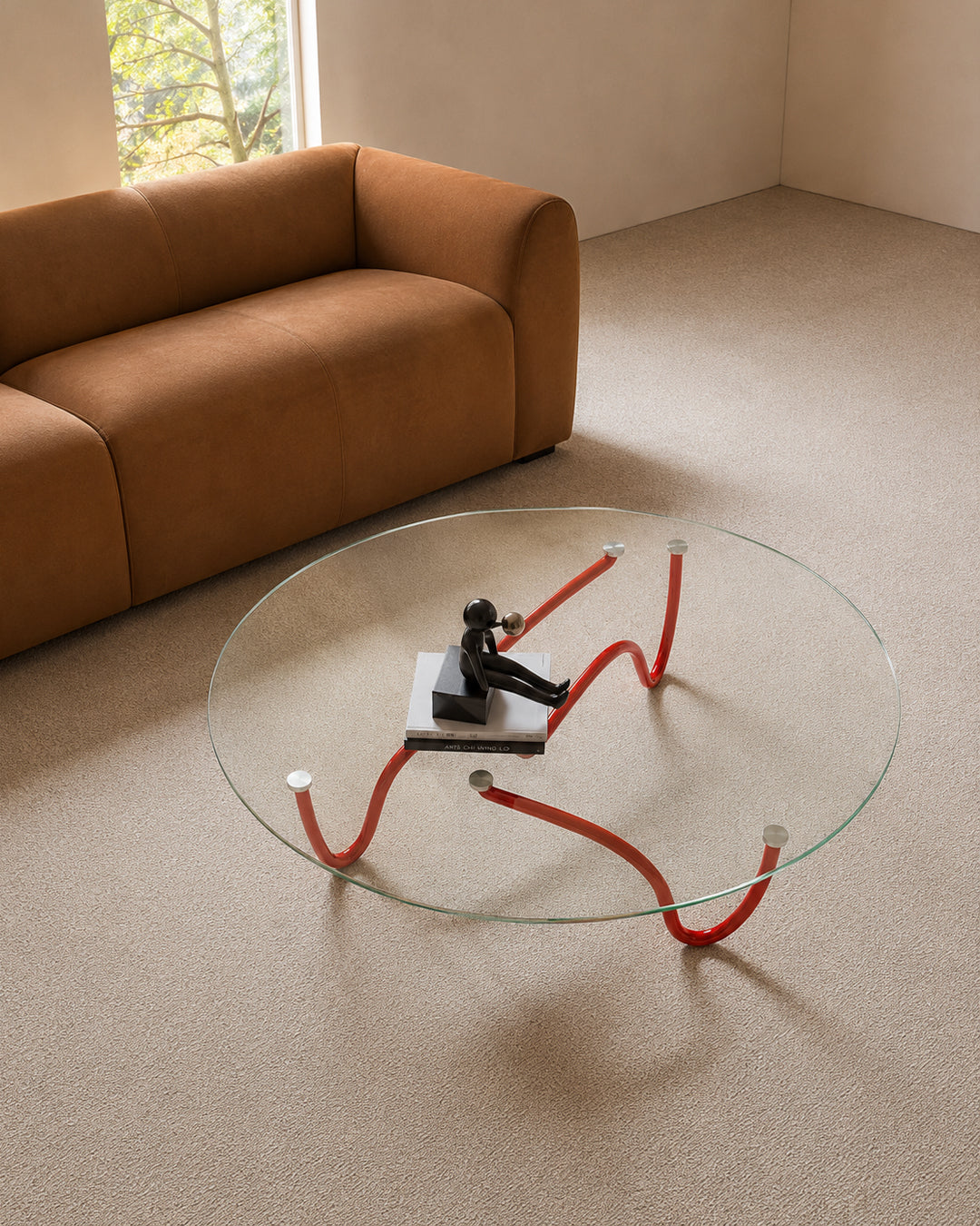 Glass coffee table styled in a living room setting
