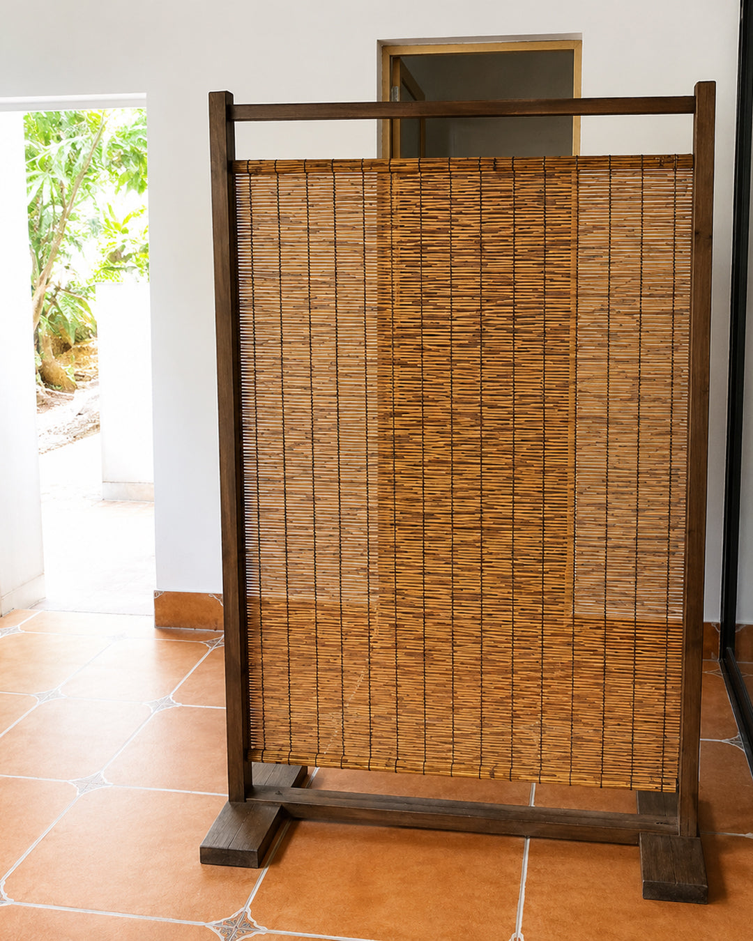 Detail of wood frame joinery on reed room divider