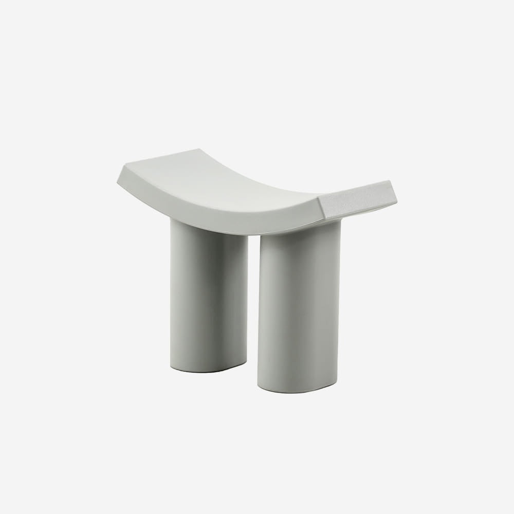sculptural modern stool with curved seat design