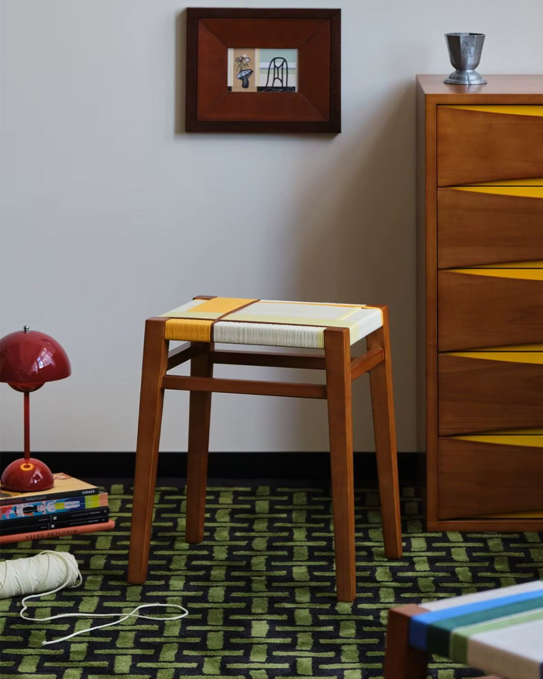danish cord stool used as an entryway bench seat