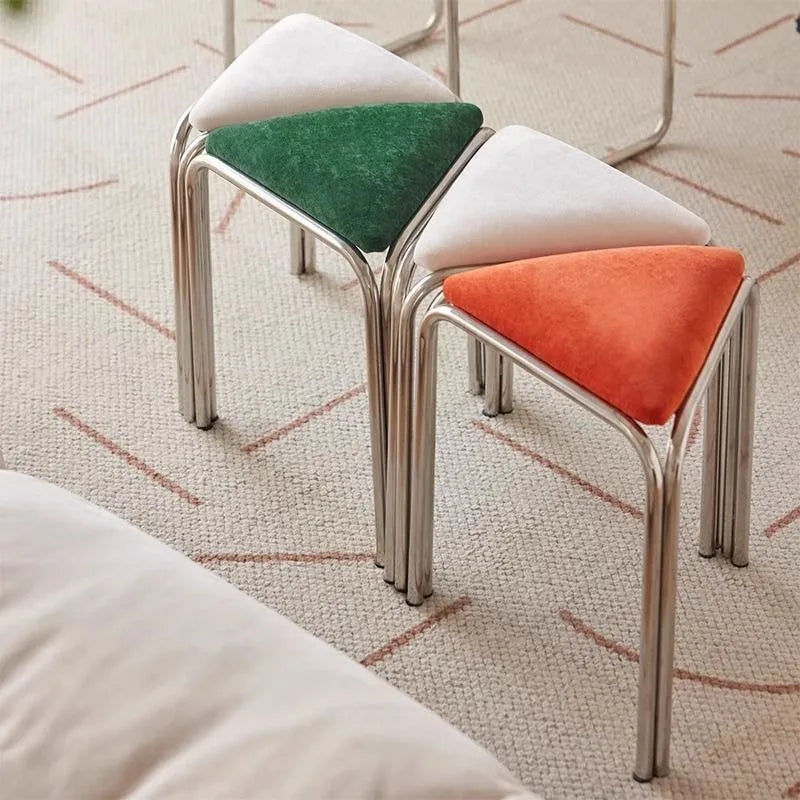 Triangle chrome stacking stools in green, white, and orange, front view