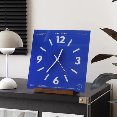 Close-up of silent movement hands on square wall clock face