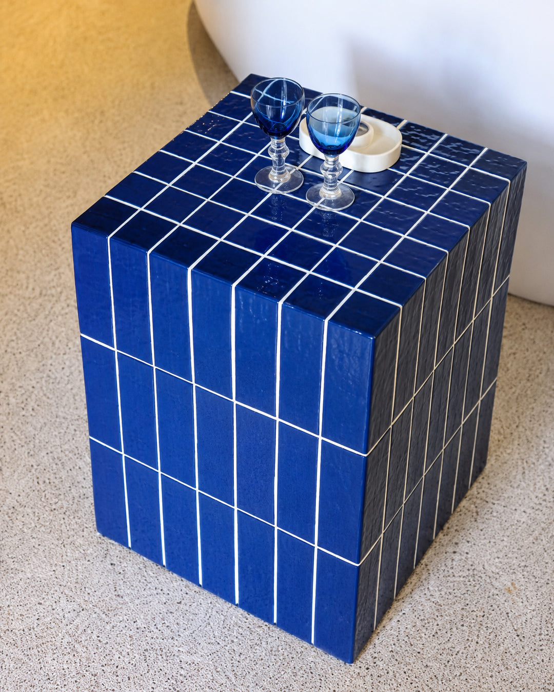 blue tile cube side table shown in a living room setting