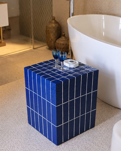 blue tile cube stool closeup detail shot showing glossy subway tile texture