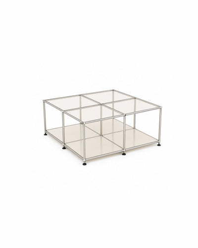 Modular glass and steel cube table in a beige-toned room
