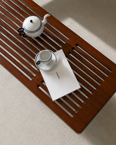 Top-down view of solid wood slat bench surface