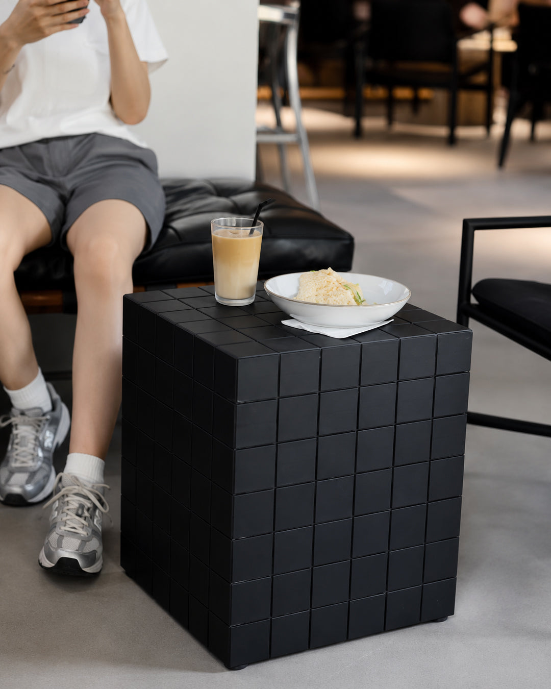 cube side table shown styled in a modern living room