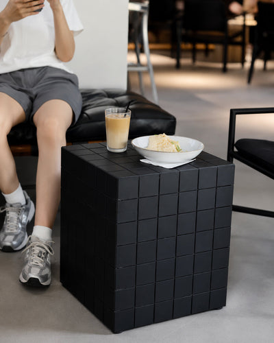 cube side table shown styled in a modern living room
