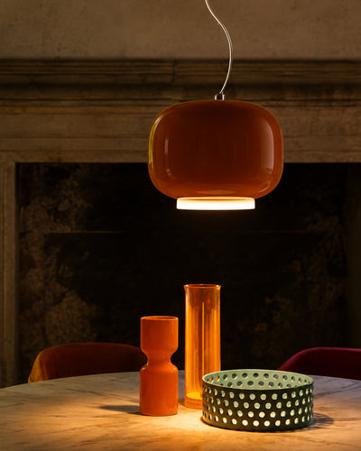 Glass stone pendant light illuminated, showing warm glow