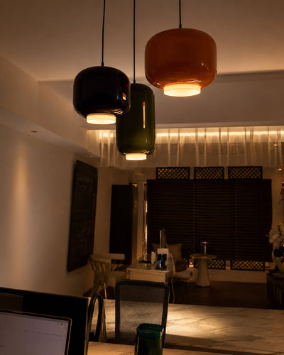 Multiple glass stone pendant lights clustered together