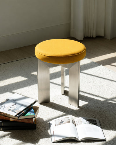 accent stool shown styled as a bedroom vanity seat