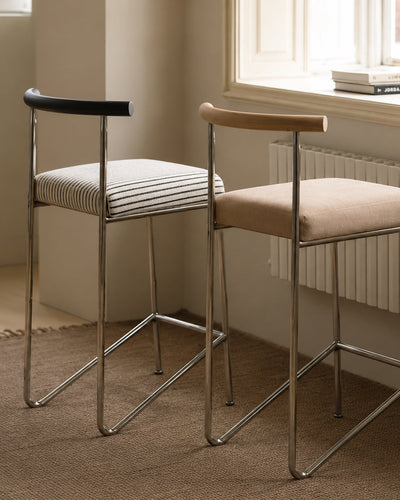 wire frame bar stool shown styled at a kitchen island counter