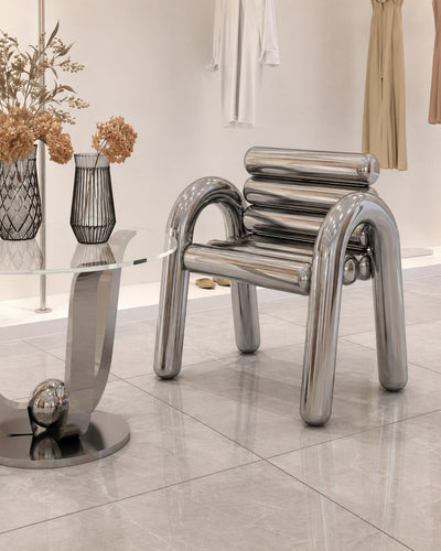 Reflective polished steel finish detail on tube seating frame