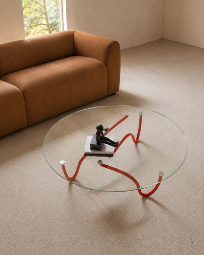 Glass coffee table styled in a living room setting