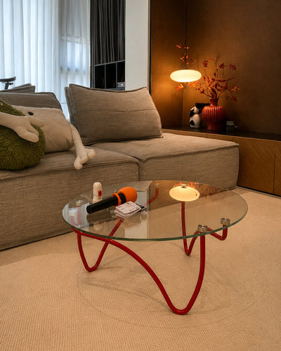 Glass coffee table paired with a sofa in a lounge setting