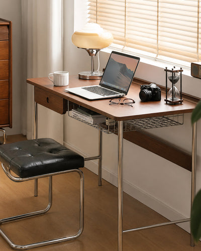 Side profile of walnut desk showing metal leg frame