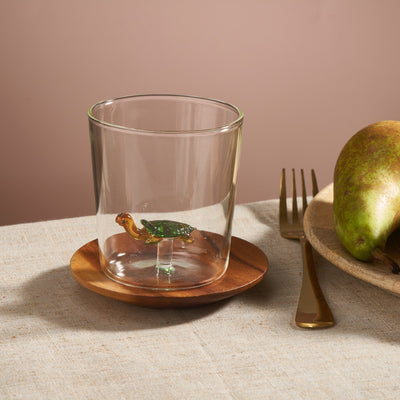 glass cup with animal figurine inside