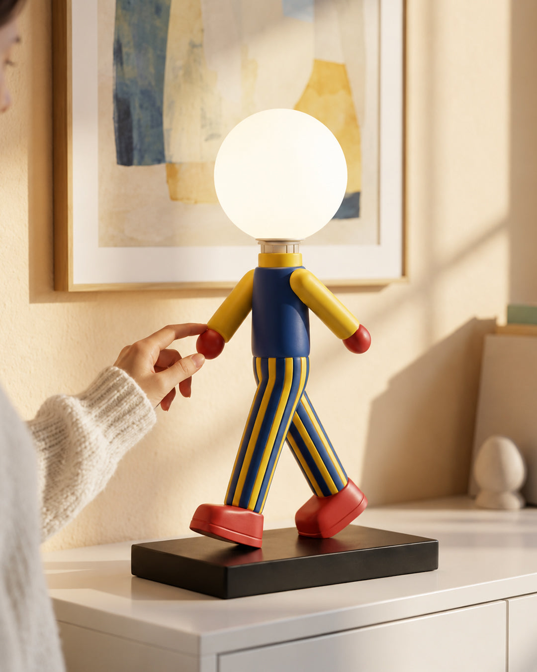 Resin figure table lamp styled on a nightstand