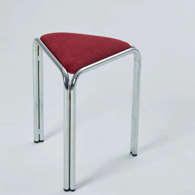 Burgundy velvet triangle stacking stool on chrome tube legs, studio shot