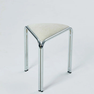 White velvet triangle stacking stool on chrome tube legs, studio shot