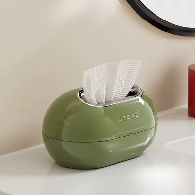 space saving bathroom tissue box with easy access spring mechanism
