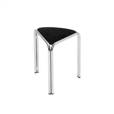 Black velvet triangle stacking stool on chrome tube legs, studio shot