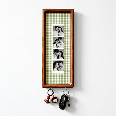 Green check wood photo strip frame with key hooks, studio shot