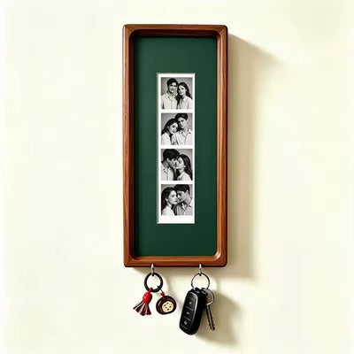 Dark green wood photo strip frame with key hooks, studio shot