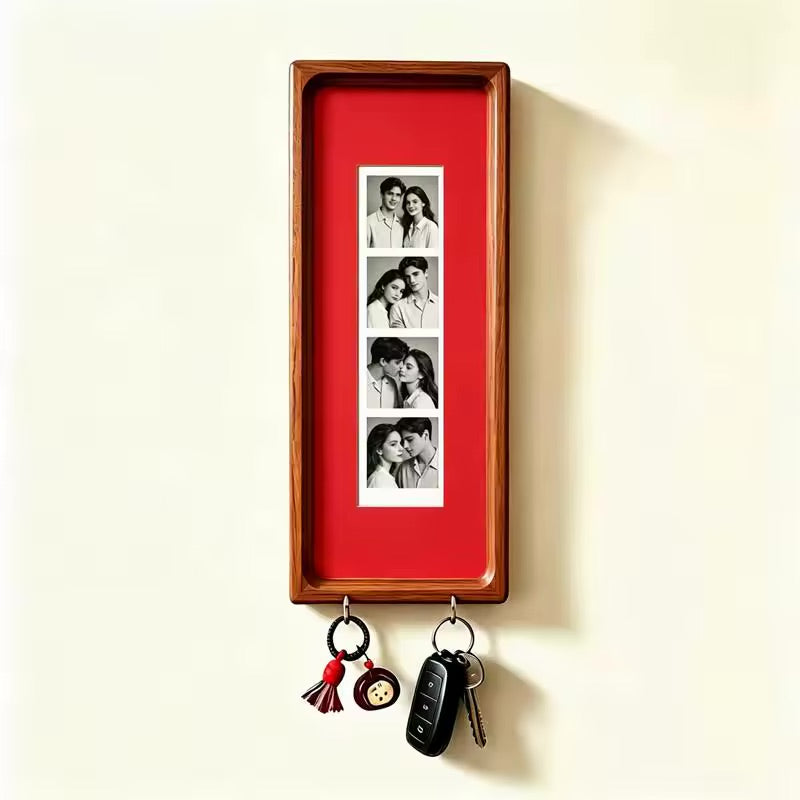 Solid red wood photo strip frame with key hooks, alternate studio angle