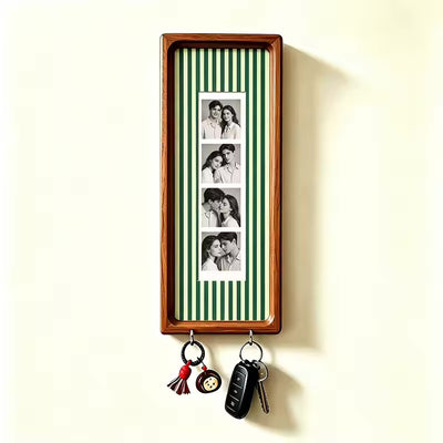 Sage green pinstripe wood photo strip frame with key hooks, alternate studio angle