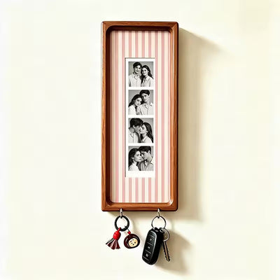 Pink pinstripe wood photo strip frame with key hooks, studio shot