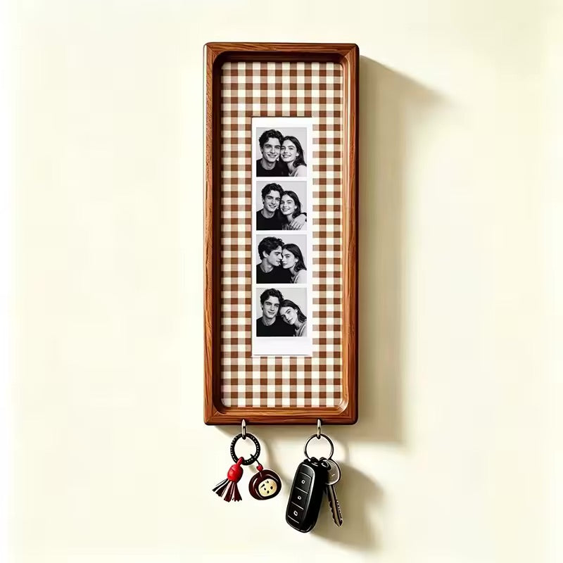 Brown check wood photo strip frame with key hooks, studio shot