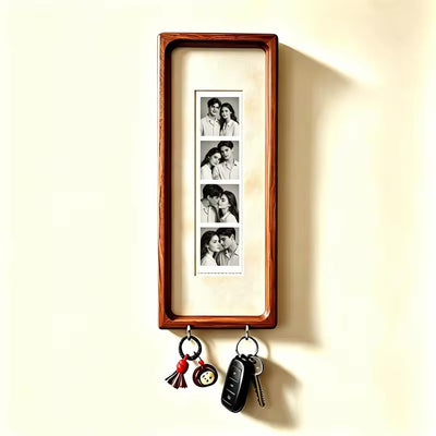 Natural cream wood photo strip frame with key hooks, studio shot