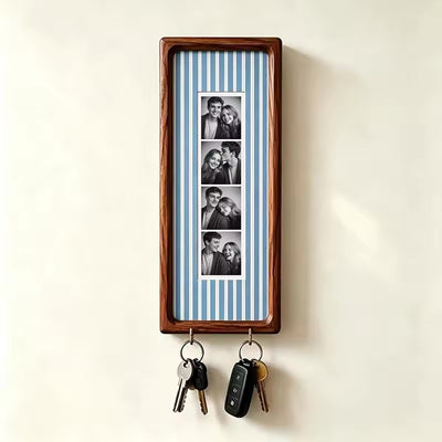 Blue pinstripe wood photo strip frame with key hooks, studio shot