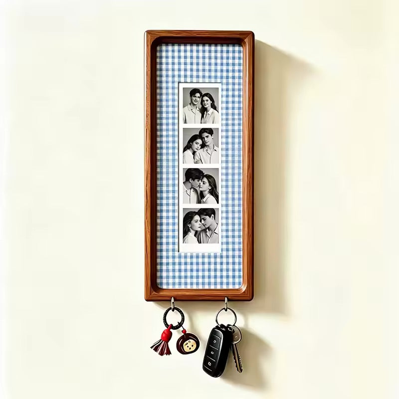 Blue check wood photo strip frame with key hooks, studio shot