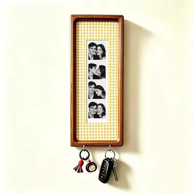 Yellow check wood photo strip frame with key hooks, studio shot