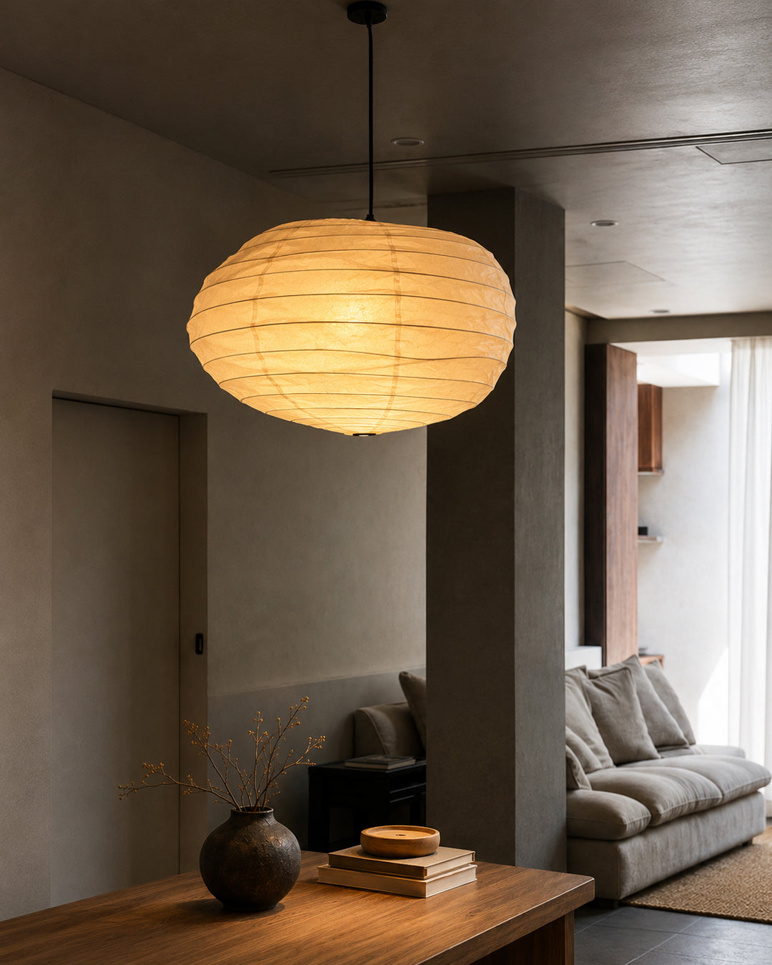 Rice paper pendant lamp hung over a dining table