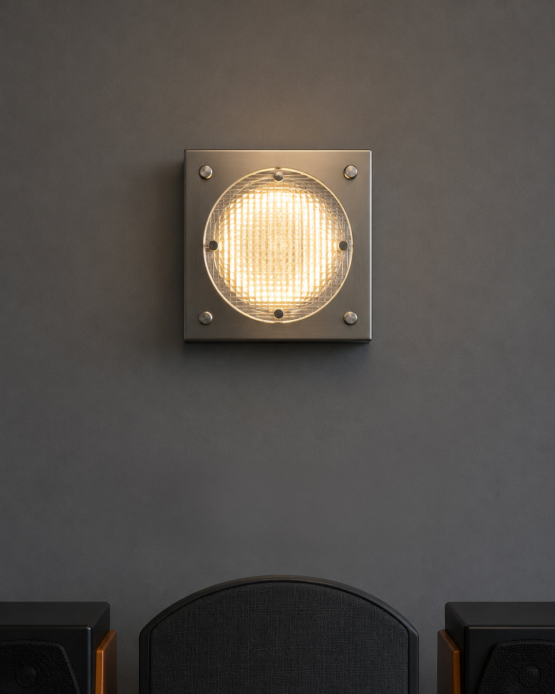 stainless steel wall sconce closeup detail shot showing acrylic grid lens texture
