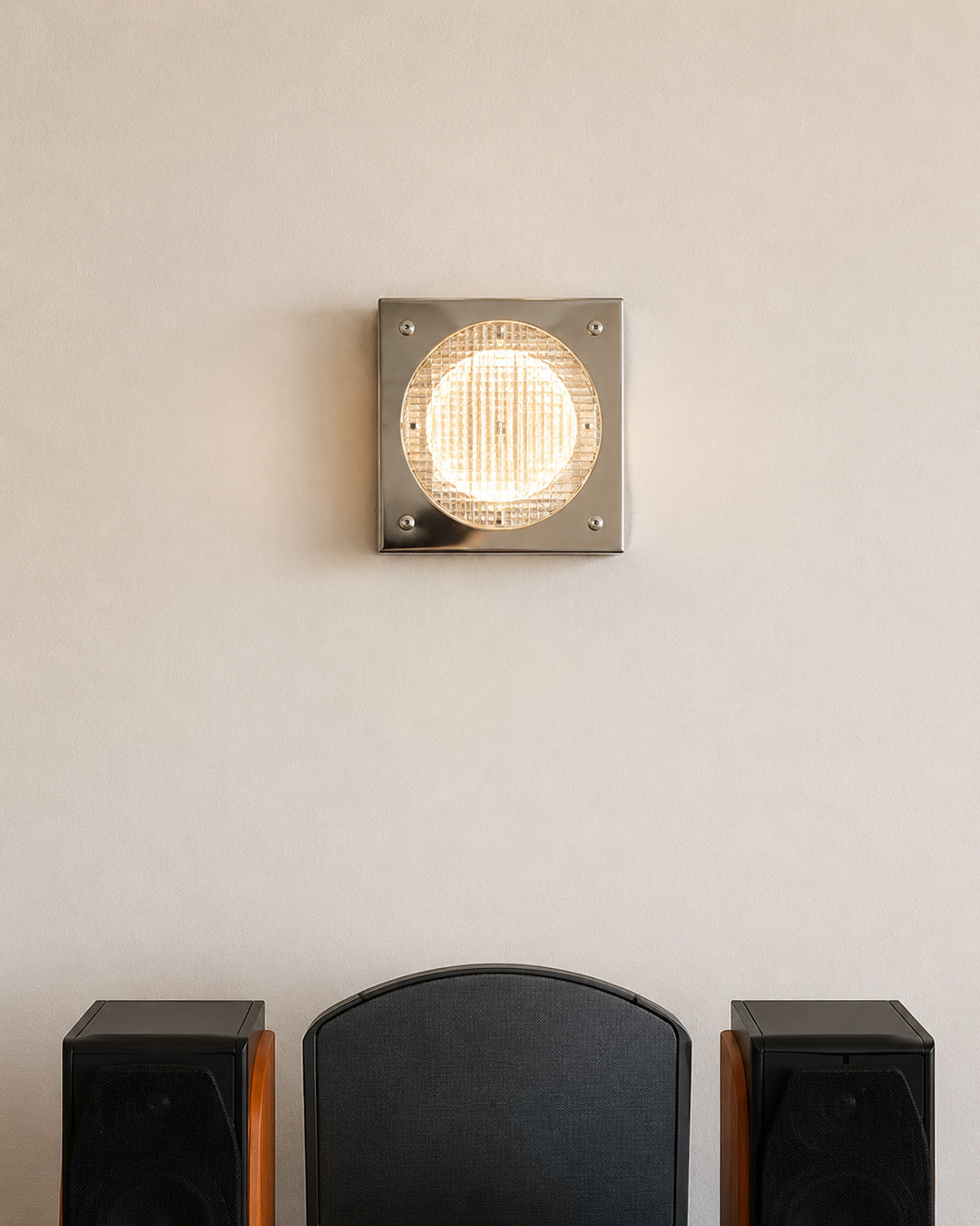 square wall sconce shown mounted in a hallway setting