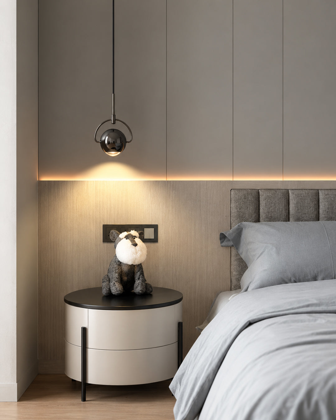 orb pendant light shown as a bedside hanging lamp