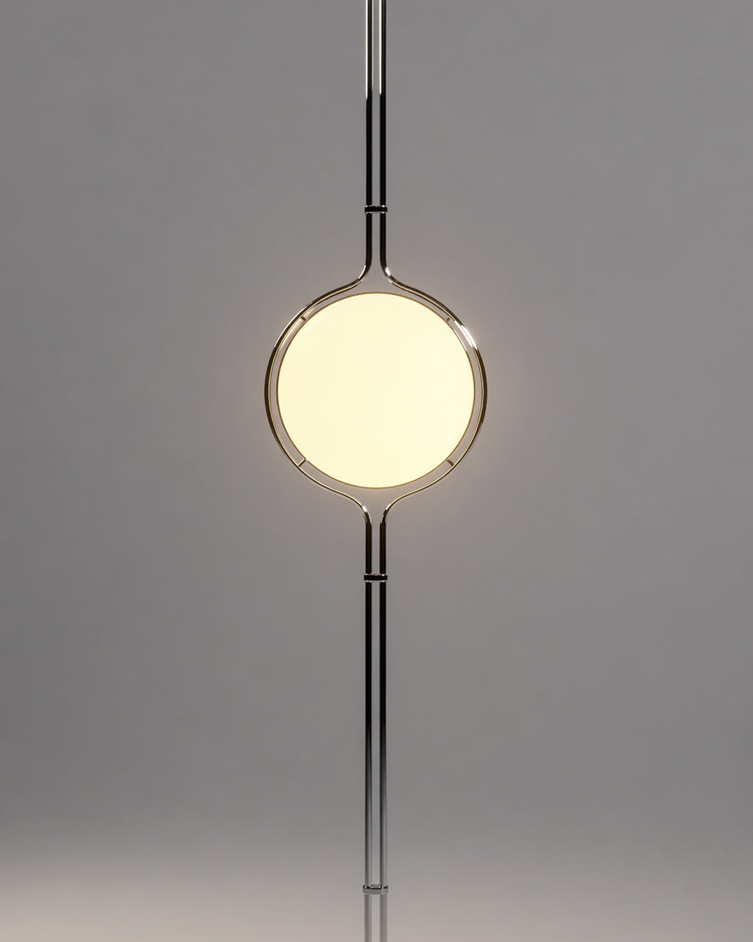 Tension pole lamp illuminated, showing warm glow