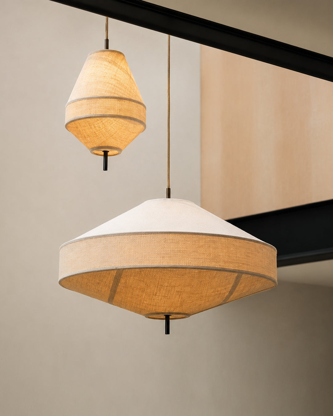 Linen pendant light hung over a dining table