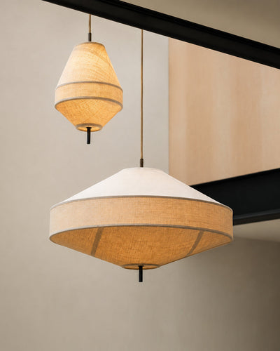 Linen pendant light hung over a dining table