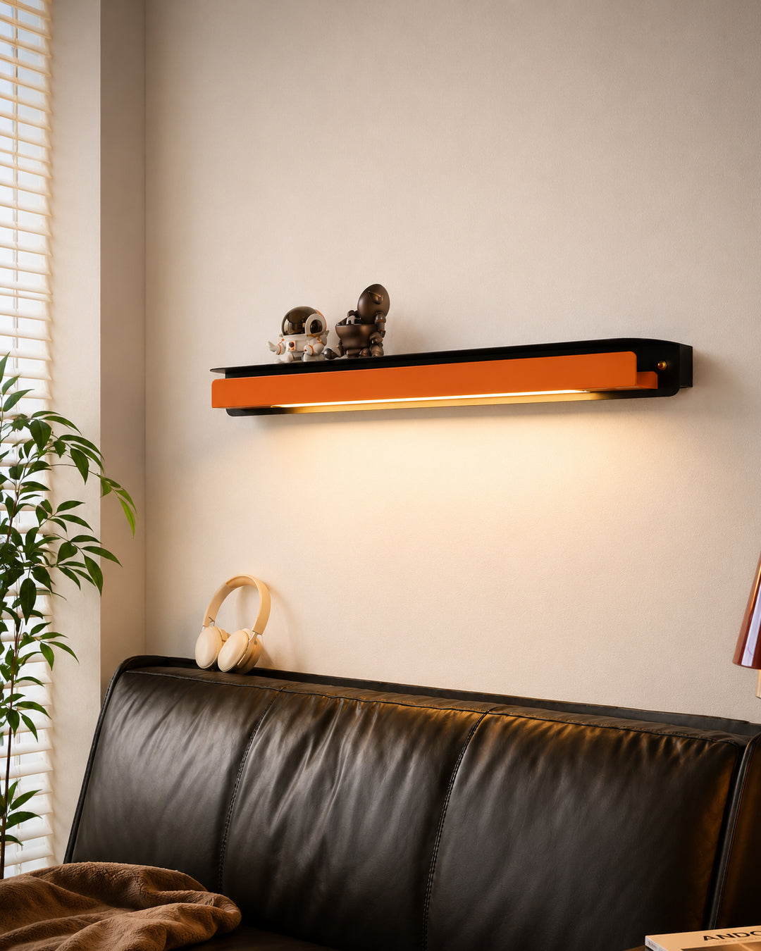 Wall lamp mounted above a bedroom nightstand
