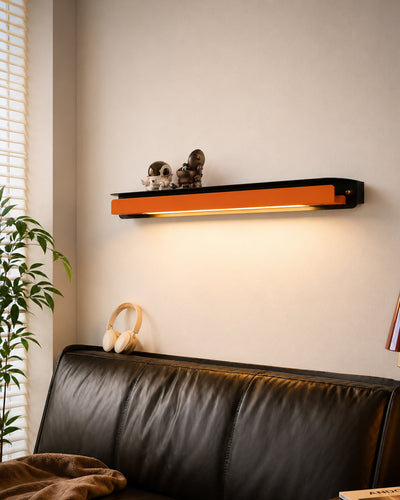 Wall lamp mounted above a bedroom nightstand
