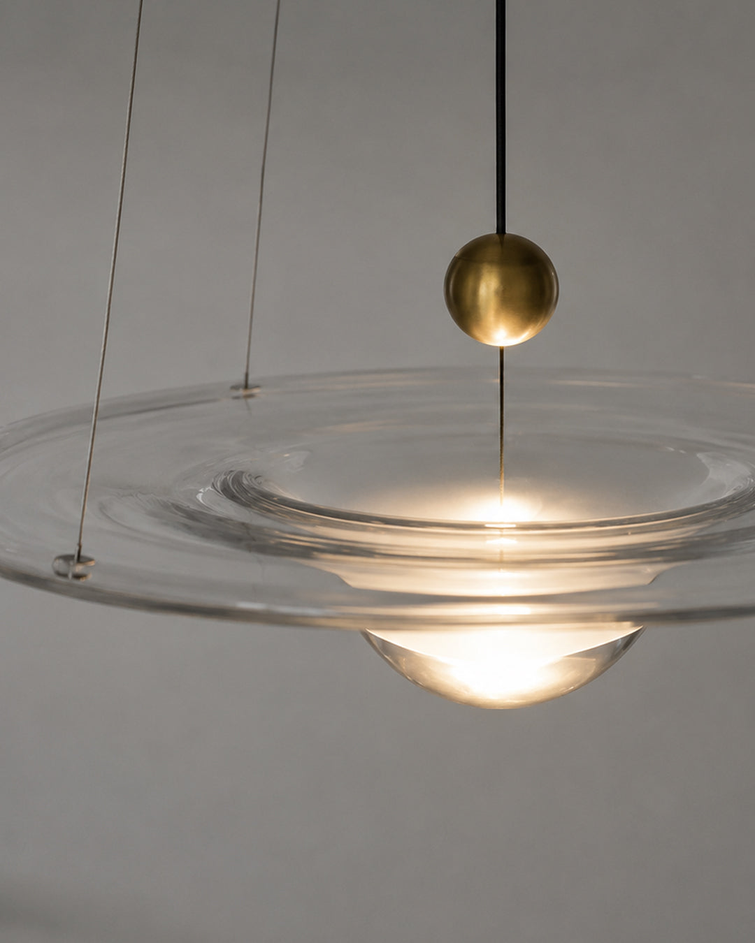 Ripple pattern projected on ceiling by glass pendant light