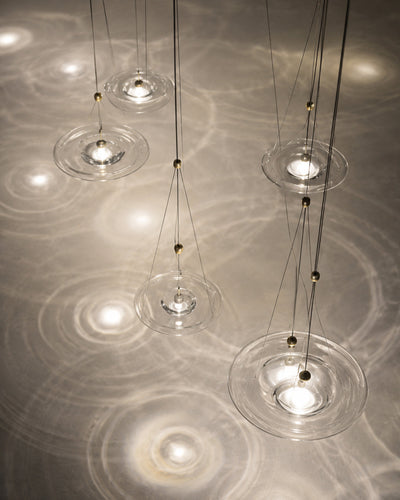 Ripple glass pendant light styled over a dining table