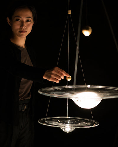 Side profile of floating glass disc pendant light